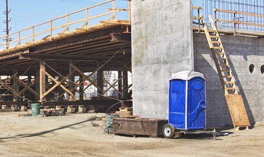 the convenience of on-site restrooms a work site lined with portable restrooms